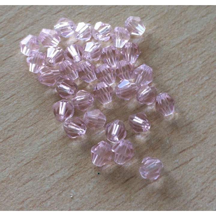 Sachet de perles à facettes bicône rose orchidée
